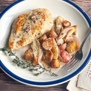 chicken-and-potatoes-in-cider-cream-sauce-on-a-plate