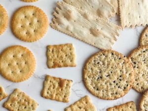 Assorted crackers on a white background.