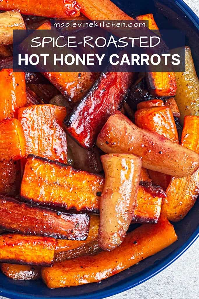 Hot honey carrots in a blue bowl with text overlay for Pinterest pin.