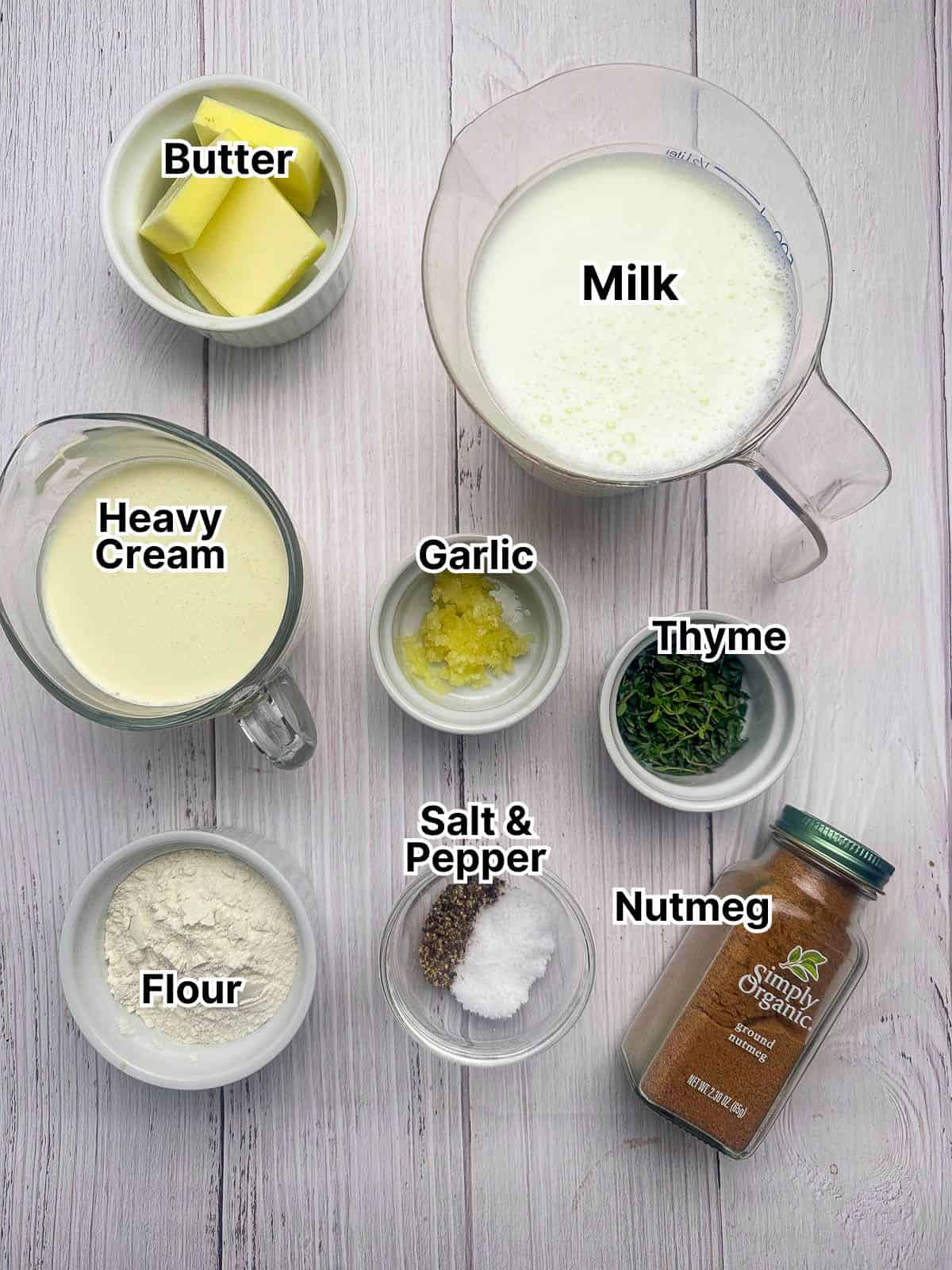 Ingredients for the mornay cheese sauce laid out in small bowls.