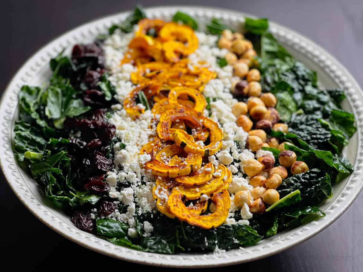 Fall kale salad with roasted Delicata squash, hazelnuts, and crumbled goat cheese.