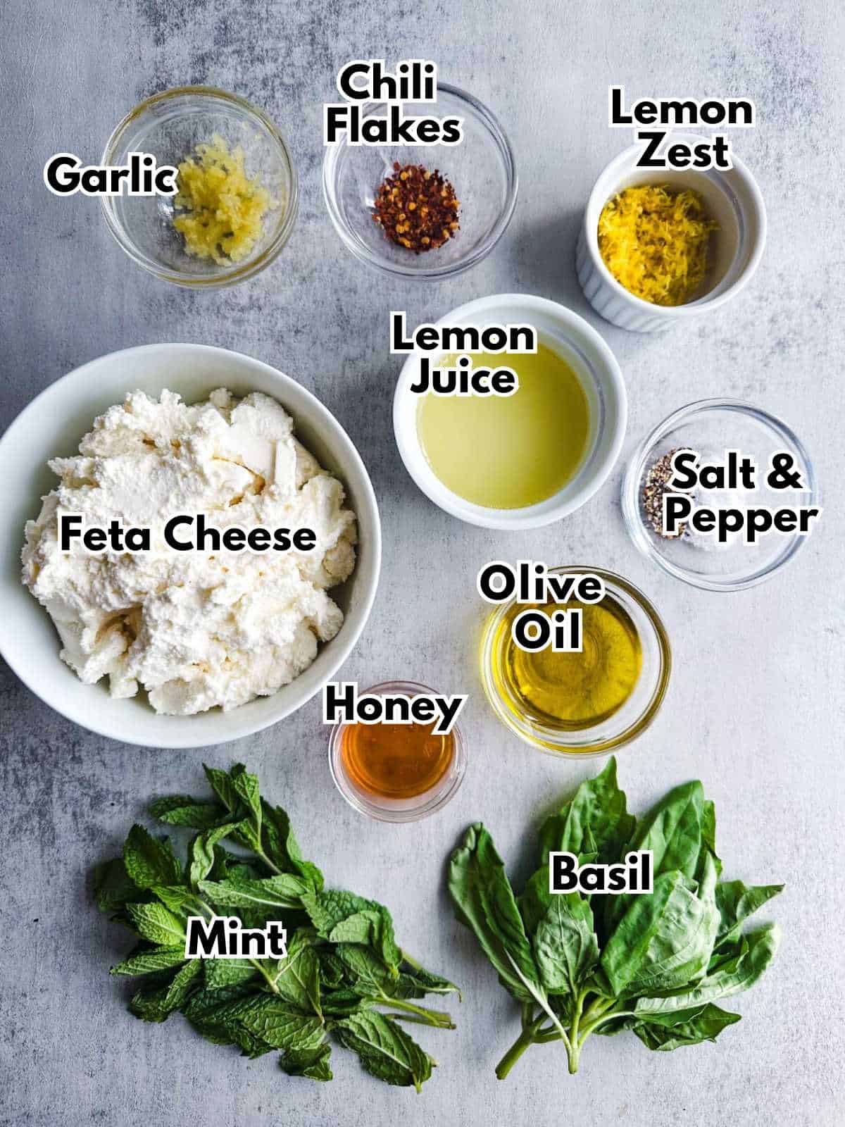 Ingredients for whipped ricotta dip with garlic and herbs.