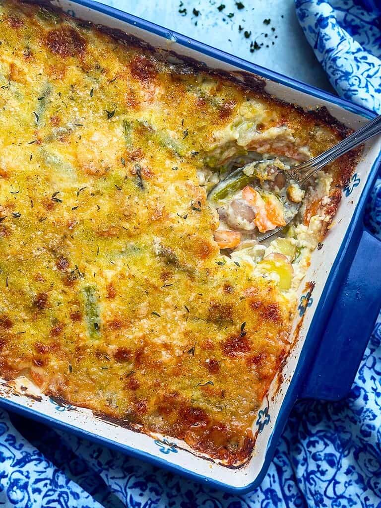 Spring vegetable casserole with golden crust and melted cheese.