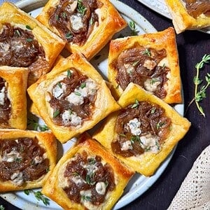 Caramelized onion puff pastry tarts with blue cheese.